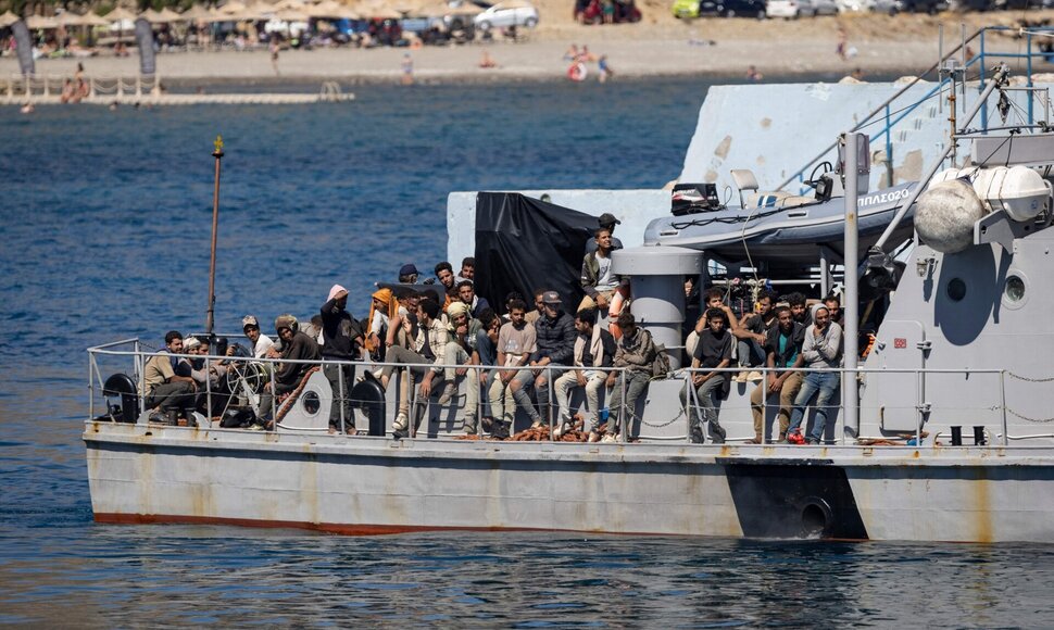 Migrantai / COSTAS METAXAKIS / AFP